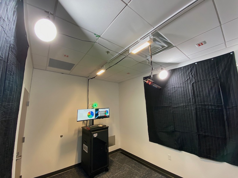 Another angle, showing the acoustic panels on both walls, as well as the ceiling-mounted LED lighting.